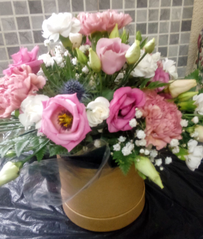 Small Hat Box - A small hat box with a mixed seasonal arrangement in oasis