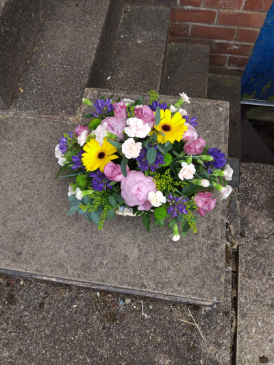Sherbet Twist - This delightful collection of seasonal blooms is a beautiful way to send your affections. A pretty arrangement in a classic basket simply fizzing with joy and character.