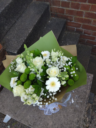Evelyn - A fabulous collection of white and cream flowers make this the perfect gift. This bouquet will be hand delivered by the local florist.