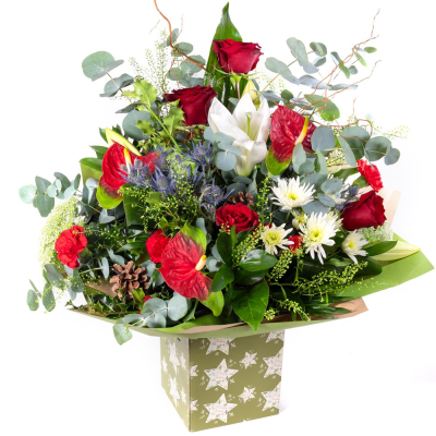 The Grand Christmas Elegance  - Make the season unforgettable with The Grand Christmas Elegance. A show-stopping arrangement of rich festive tones and luxurious textures, beautifully styled with seasonal foliage and elegant finishing touches. Designed to impress, it’s the perfect centerpiece for Christmas gifting and celebrations.
