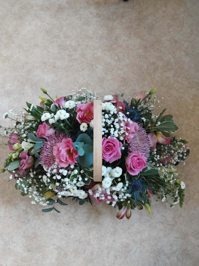 something special - A basket containing pink and white flowers in floral foam